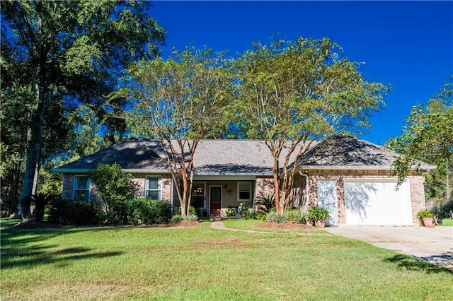 28230 Stanga Rd, Ponchatoula, LA 70454 - ranch-style home with driveway, a garage, a front lawn, and brick siding