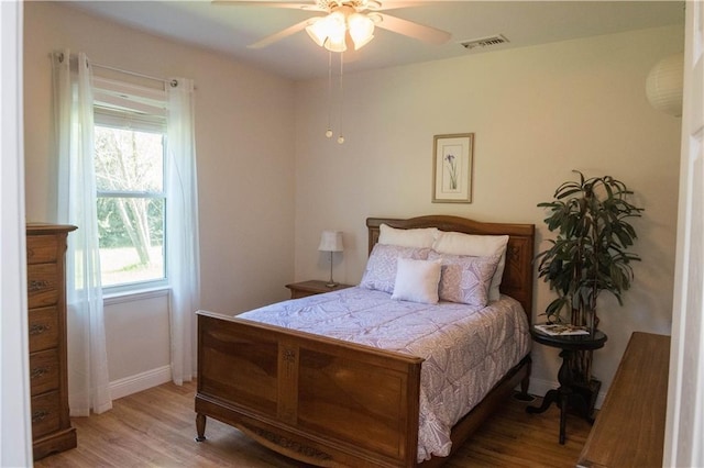 28230 Stanga Rd, Ponchatoula, LA 70454 - bedroom featuring wood finished floors, baseboards, and a ceiling fan