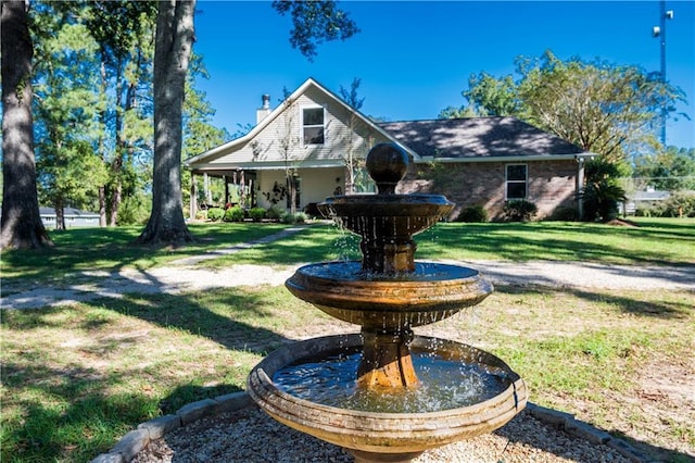 28230 Stanga Rd, Ponchatoula, LA 70454 - view of front facade with a front lawn and a chimney
