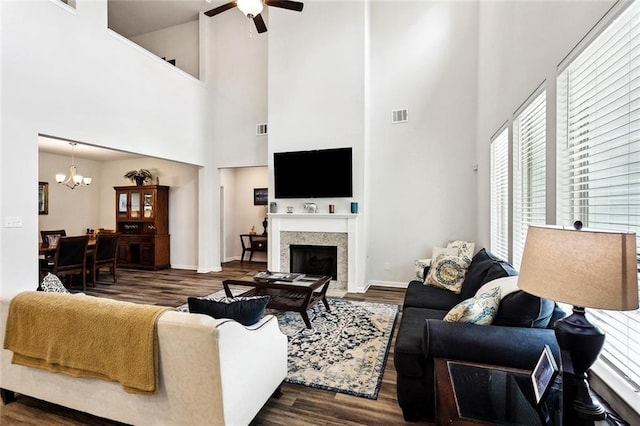 40315 Cypress Reserve Blvd, Ponchatoula, LA 70454 - living area with ceiling fan, dark wood-style flooring, a towering ceiling, a chandelier, and healthy amount of natural light