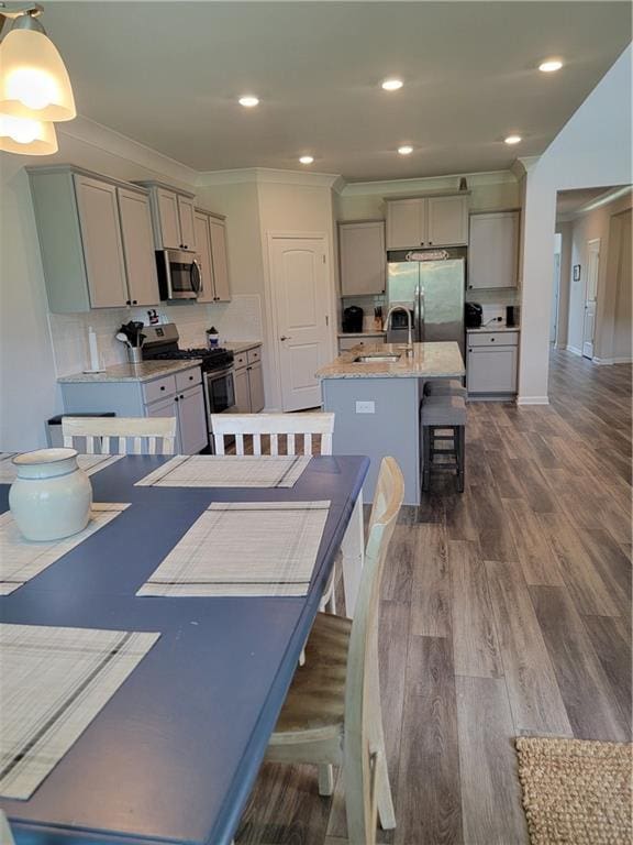40315 Cypress Reserve Blvd, Ponchatoula, LA 70454 - dining space featuring dark wood finished floors, ornamental molding, recessed lighting, and baseboards