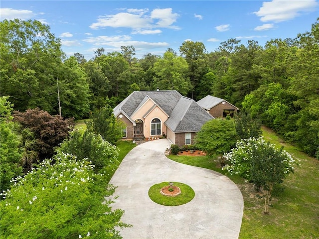 47261 Eldridge Magee Rd, Franklinton, LA 70438 - view of front of house featuring curved driveway and a forest view