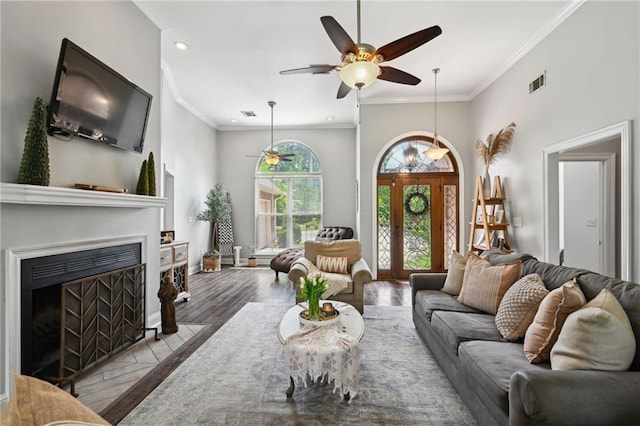 47261 Eldridge Magee Rd, Franklinton, LA 70438 - living room featuring wood finished floors, ceiling fan, recessed lighting, ornamental molding, and a fireplace with flush hearth