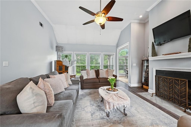 47261 Eldridge Magee Rd, Franklinton, LA 70438 - living area featuring lofted ceiling, ceiling fan, crown molding, baseboards, and a fireplace with flush hearth