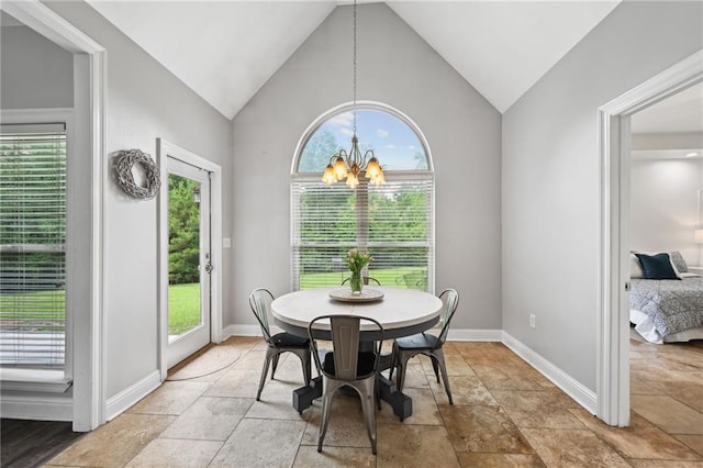 47261 Eldridge Magee Rd, Franklinton, LA 70438 - dining area with a chandelier, lofted ceiling, baseboards, and light stone finish flooring