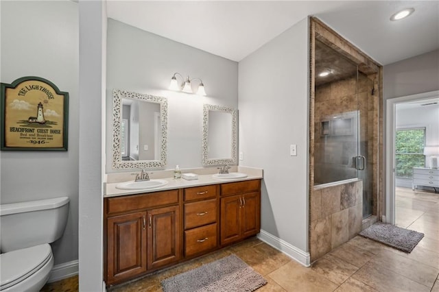 47261 Eldridge Magee Rd, Franklinton, LA 70438 - full bath with double vanity, baseboards, a shower stall, toilet, and recessed lighting