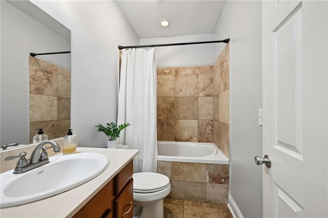 47261 Eldridge Magee Rd, Franklinton, LA 70438 - full bathroom with tiled shower / bath combo, vanity, toilet, and stone finish floors