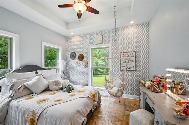 47261 Eldridge Magee Rd, Franklinton, LA 70438 - bedroom featuring stone tile flooring, baseboards, recessed lighting, a tray ceiling, and a ceiling fan