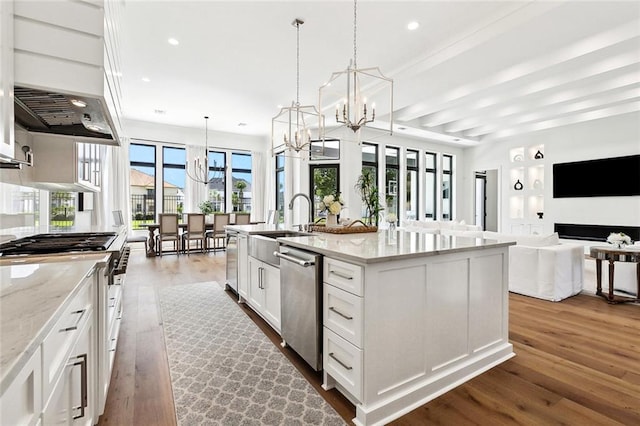 25 Cycas, Kenner, LA 70065 - kitchen with appliances with stainless steel finishes, a chandelier, dark wood-style floors, white cabinets, and recessed lighting