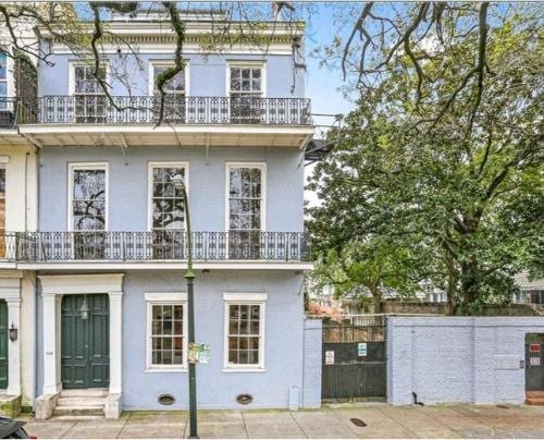 908-10 Esplanade Ave, New Orleans, LA 70116 - rear view of property featuring a balcony and stucco siding