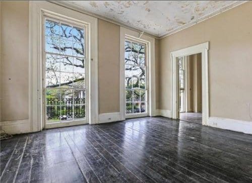 908-10 Esplanade Ave, New Orleans, LA 70116 - unfurnished room featuring healthy amount of natural light, wood-type flooring, and crown molding