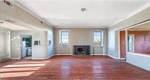 908-10 Esplanade Ave, New Orleans, LA 70116 - unfurnished living room featuring a fireplace, crown molding, wood finished floors, and baseboards