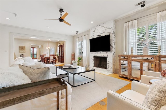 109 Northline St, Metairie, LA 70005 - living area featuring ceiling fan, ornamental molding, light wood finished floors, a fireplace, and recessed lighting