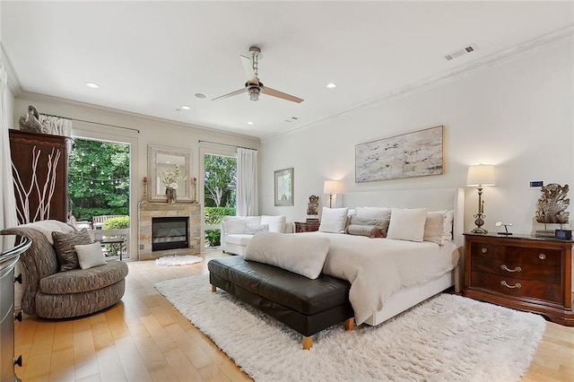 109 Northline St, Metairie, LA 70005 - bedroom featuring access to outside, crown molding, wood finished floors, a glass covered fireplace, and recessed lighting