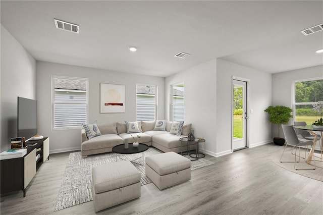5349 Bypass Breeze Dr, Slidell, LA 70461 - living room featuring baseboards, light wood-style floors, and recessed lighting