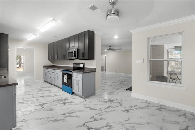 213 Loop Dr, Slidell, LA 70458 - kitchen featuring stainless steel appliances, light marble finish floors, dark countertops, baseboards, and ceiling fan