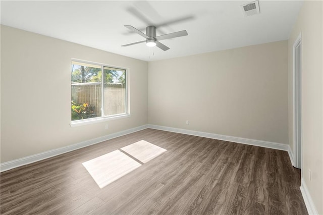 213 Loop Dr, Slidell, LA 70458 - spare room with wood finished floors, ceiling fan, and baseboards