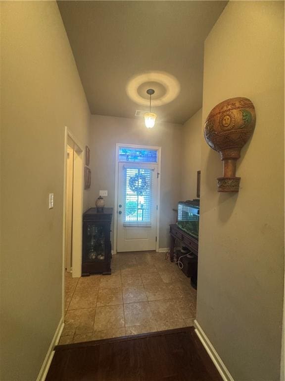 11018 Regency Ave, Hammond, LA 70403 - doorway with baseboards and tile patterned flooring