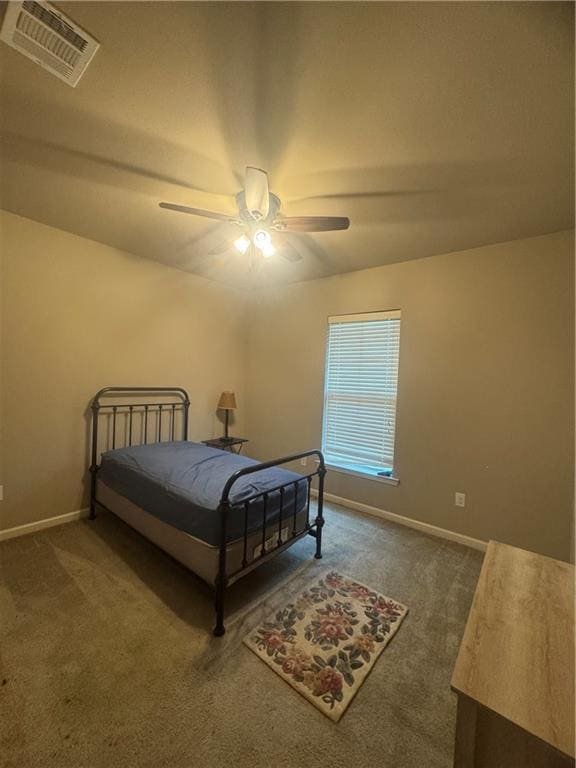11018 Regency Ave, Hammond, LA 70403 - bedroom with carpet floors, baseboards, and a ceiling fan