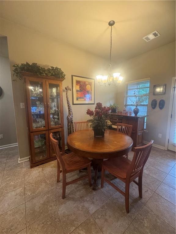 11018 Regency Ave, Hammond, LA 70403 - dining space featuring a chandelier and baseboards