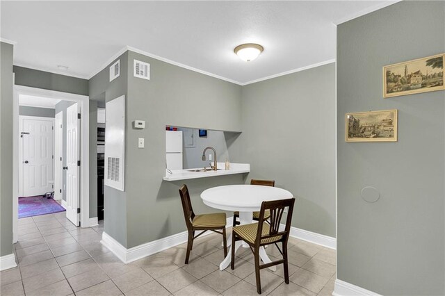 4101 Hessmer Ave Unit 109, Metairie, LA 70002 - dining area with baseboards, ornamental molding, and light tile patterned flooring