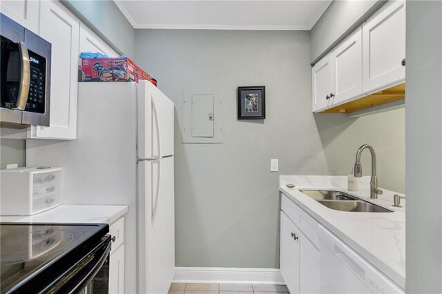 4101 Hessmer Ave Unit 109, Metairie, LA 70002 - laundry area with a sink, crown molding, baseboards, light tile patterned flooring, and electric panel