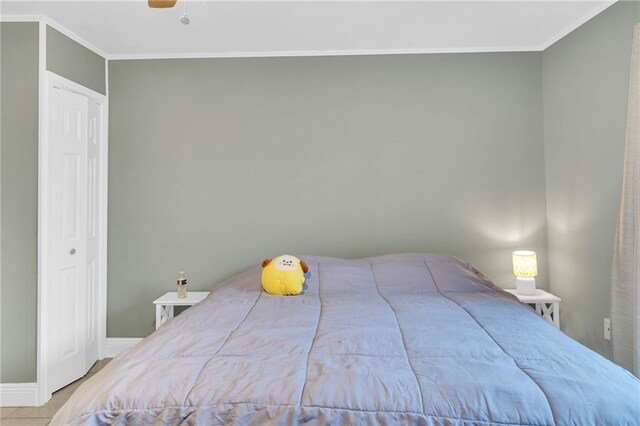 4101 Hessmer Ave Unit 109, Metairie, LA 70002 - bedroom with ornamental molding, baseboards, and ceiling fan