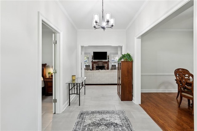 126 Rue Acadian, Belle Chasse, LA 70037 - corridor featuring crown molding, a chandelier, and baseboards