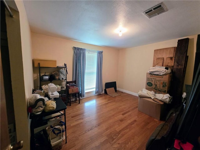 46282 Morris Rd, Hammond, LA 70401 - office with wood finished floors, baseboards, and a textured ceiling