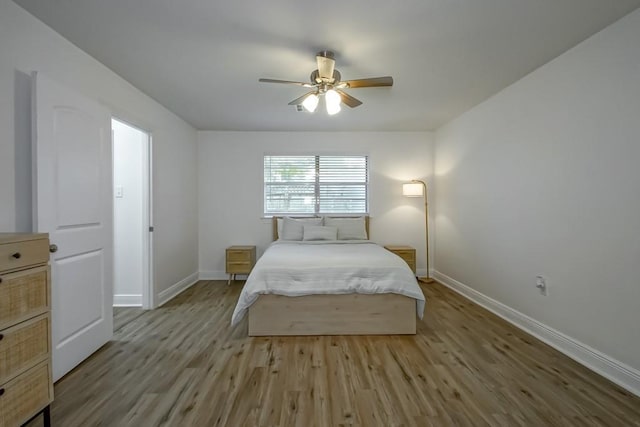1414 Englewood Dr, Slidell, LA 70458 - bedroom with baseboards, wood finished floors, and ceiling fan
