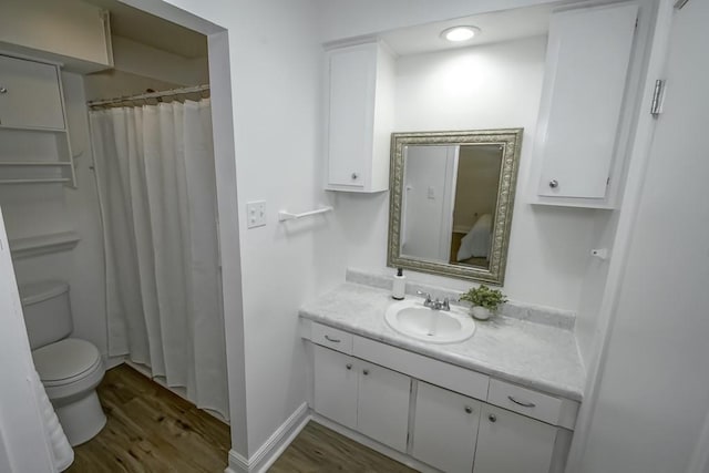 1414 Englewood Dr, Slidell, LA 70458 - bathroom with vanity, wood finished floors, toilet, and curtained shower