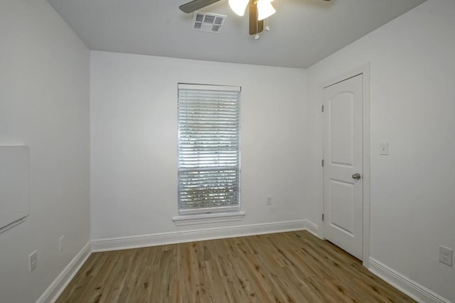1414 Englewood Dr, Slidell, LA 70458 - spare room with wood finished floors, a ceiling fan, and baseboards