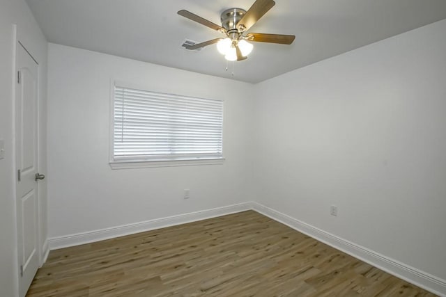 1414 Englewood Dr, Slidell, LA 70458 - unfurnished room featuring wood finished floors, baseboards, and a ceiling fan