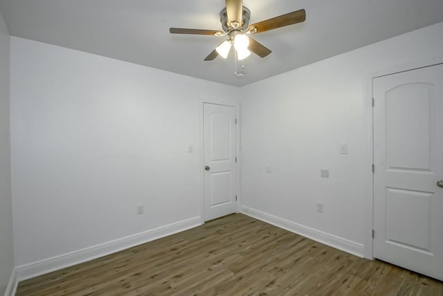 1414 Englewood Dr, Slidell, LA 70458 - empty room with wood finished floors, baseboards, and ceiling fan