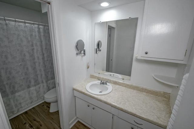 1414 Englewood Dr, Slidell, LA 70458 - full bath with vanity, toilet, wood finished floors, and curtained shower