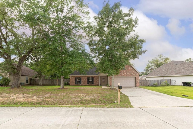 413 Oakley Blvd, Pearl River, LA 70452 - view of front of home with driveway, brick siding, and an attached garage