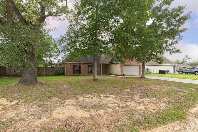 413 Oakley Blvd, Pearl River, LA 70452 - view of front of home featuring driveway, an attached garage, and brick siding