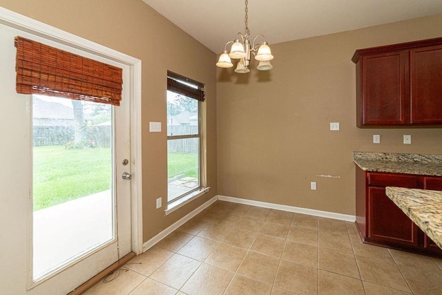 413 Oakley Blvd, Pearl River, LA 70452 - unfurnished dining area featuring a chandelier, baseboards, and light tile patterned flooring