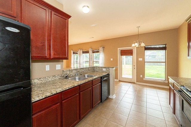 413 Oakley Blvd, Pearl River, LA 70452 - kitchen featuring black dishwasher, a chandelier, stainless steel range, a sink, and baseboards