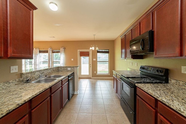 413 Oakley Blvd, Pearl River, LA 70452 - kitchen with black appliances, a sink, dark brown cabinets, a chandelier, and light tile patterned floors