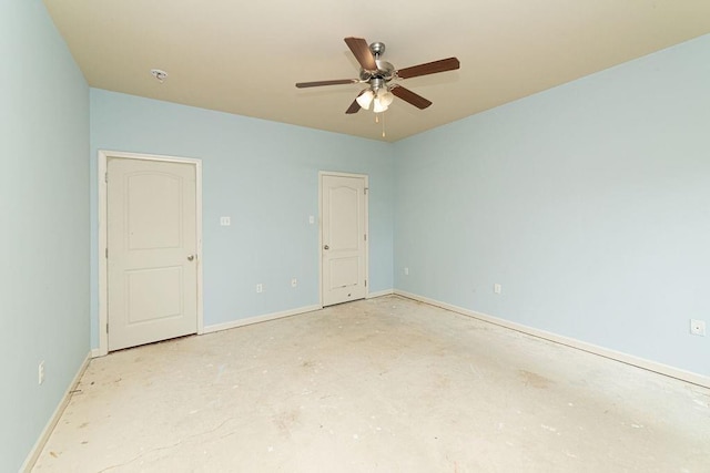 413 Oakley Blvd, Pearl River, LA 70452 - unfurnished bedroom with unfinished concrete flooring, baseboards, and ceiling fan