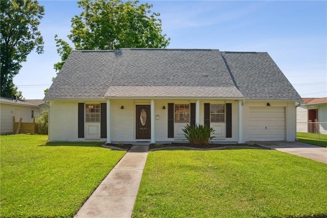 1017 Ridgefield Dr, La Place, LA 70068 - view of front facade with brick siding, an attached garage, driveway, and a shingled roof