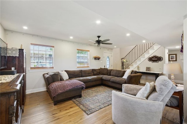 1017 Ridgefield Dr, La Place, LA 70068 - living room featuring baseboards, stairs, recessed lighting, light wood finished floors, and a ceiling fan