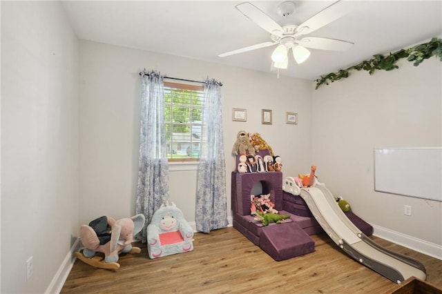 1017 Ridgefield Dr, La Place, LA 70068 - recreation room with wood finished floors, ceiling fan, and baseboards