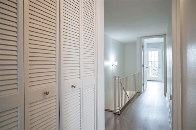 408 22 Nd St Unit 408, New Orleans, LA 70124 - hall with an upstairs landing, wood finished floors, and baseboards