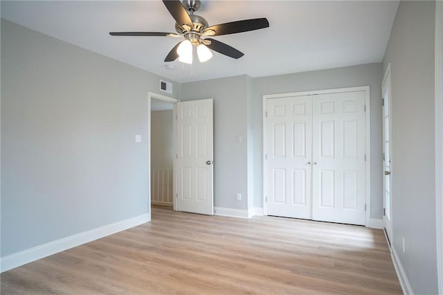 408 22 Nd St Unit 408, New Orleans, LA 70124 - unfurnished bedroom featuring light wood-type flooring, a closet, baseboards, and ceiling fan