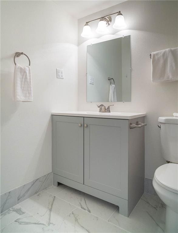 408 22 Nd St Unit 408, New Orleans, LA 70124 - bathroom with toilet, marble look tile flooring, and vanity