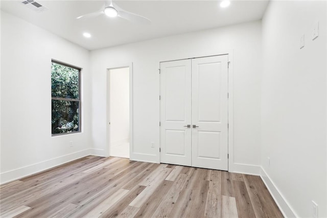 1001 Helios Ave, Metairie, LA 70005 - unfurnished bedroom featuring light wood-style floors, a closet, recessed lighting, baseboards, and a ceiling fan