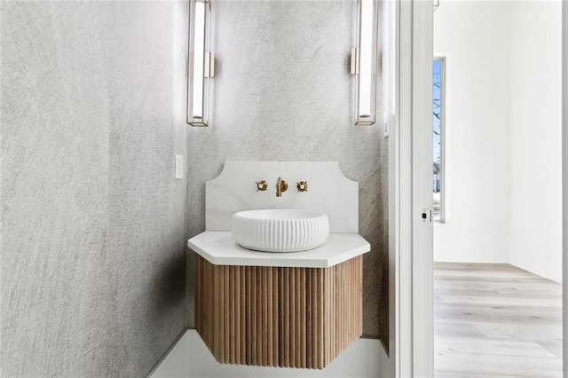 1001 Helios Ave, Metairie, LA 70005 - bathroom with vanity and wood finished floors