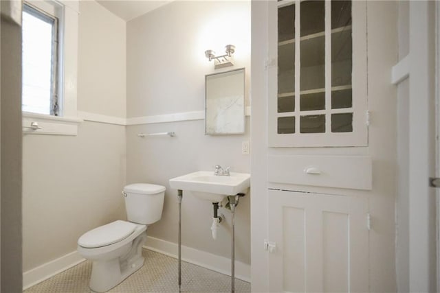 221012 Pine St, New Orleans, LA 70118 - bathroom with toilet and tile patterned flooring